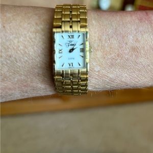 Wristwatch. Gold tone. Bracelet. Double lock fold over clasp. Like new. 3ATM